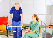 caregiver assisting patient in doing exercise